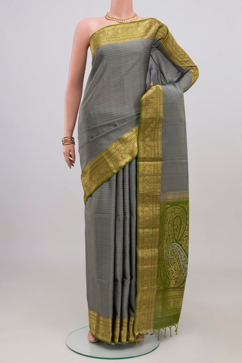 Grey Soft Silk Saree with Stripes on the body and Zari Border.  displayed on a mannequin