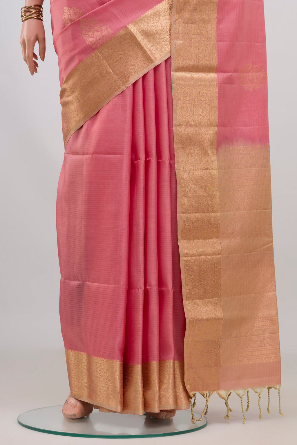 Pleats and pallu of Pure Silk Rose pink Soft Saree with Zari Butta on the body and Zari Border. 