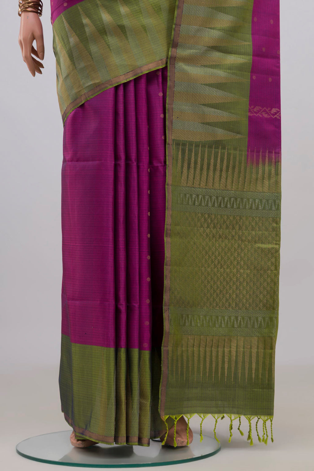 Pleats and pallu of Pure Silk Magenta Soft Saree with Zari Butta on the body and Fancy Border. 