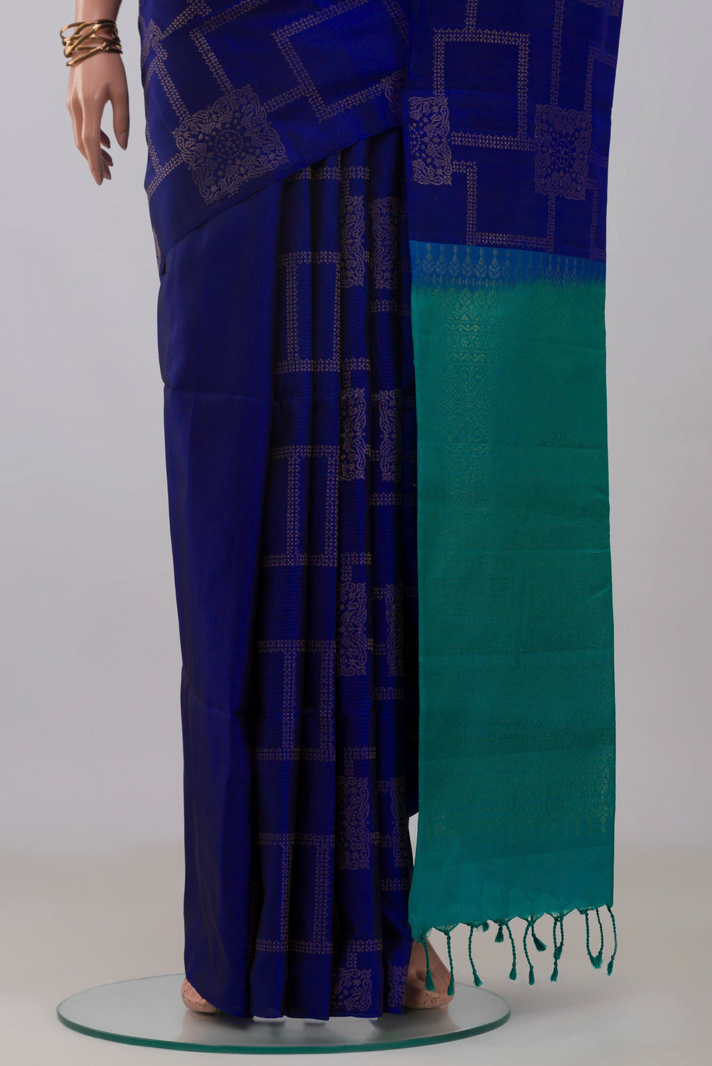 Pleats and pallu of Blue Soft Silk Saree with Zari Butta on the body and Without Border. 