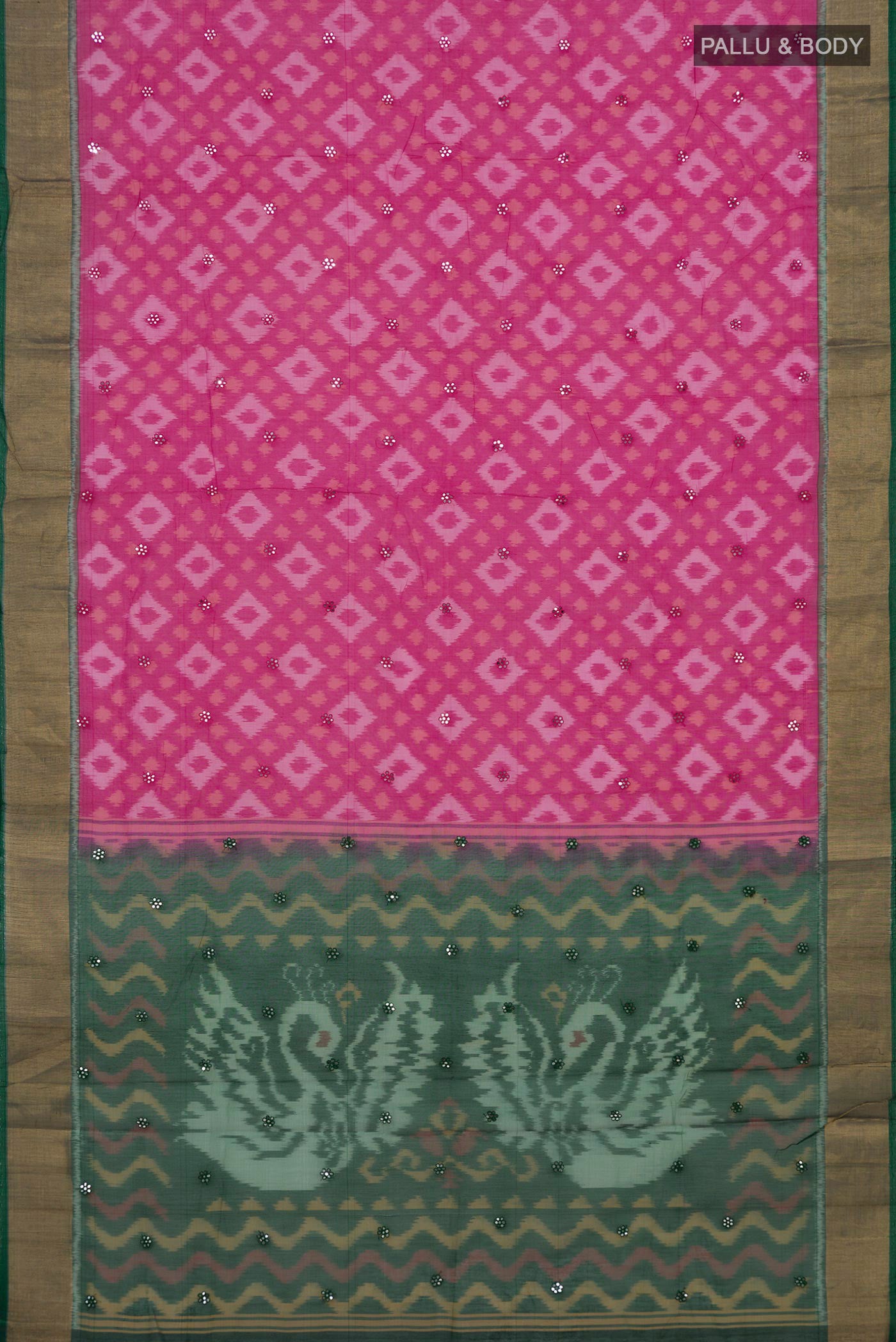 Flat view of Pink Silk Cotton Saree with Ikat design on the body and Zari Border. 