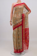 Grey Silk Cotton Saree with Ikat design on the body and Zari Border.  displayed on a mannequin