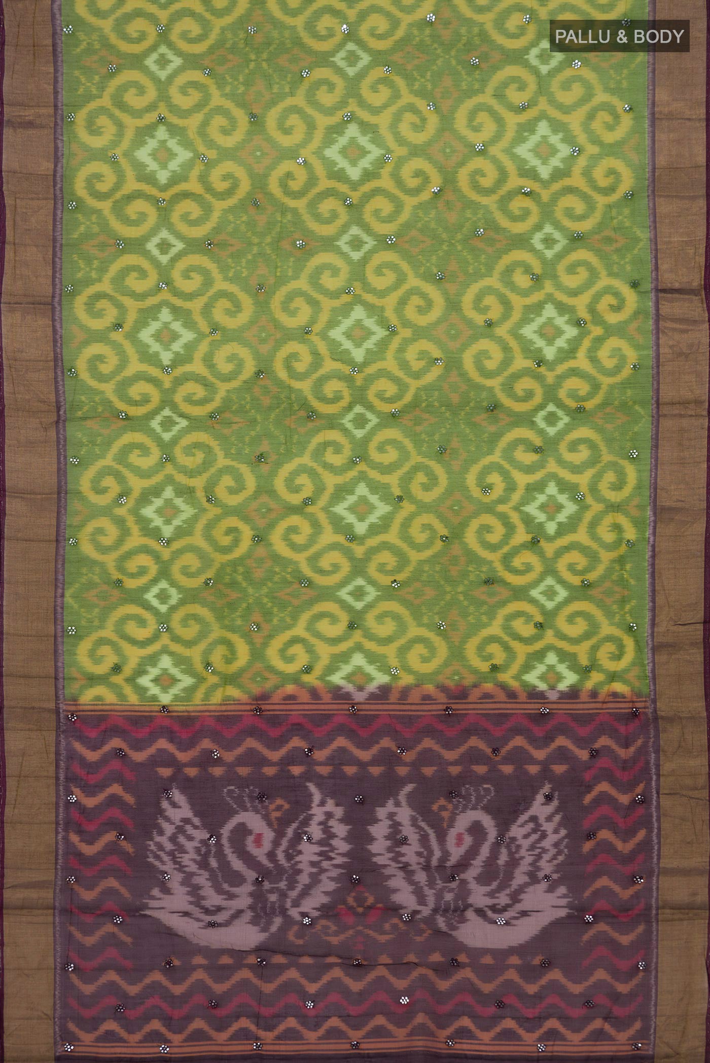 Flat view of Green Silk Cotton Saree with Ikat Print on the body and Zari Border. 