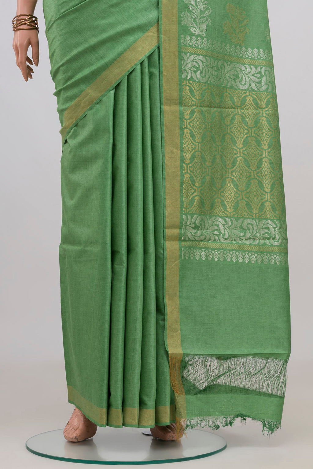 Pleats and pallu of Pista Green Tussar Silk Saree with Plain Body and Zari Border. 