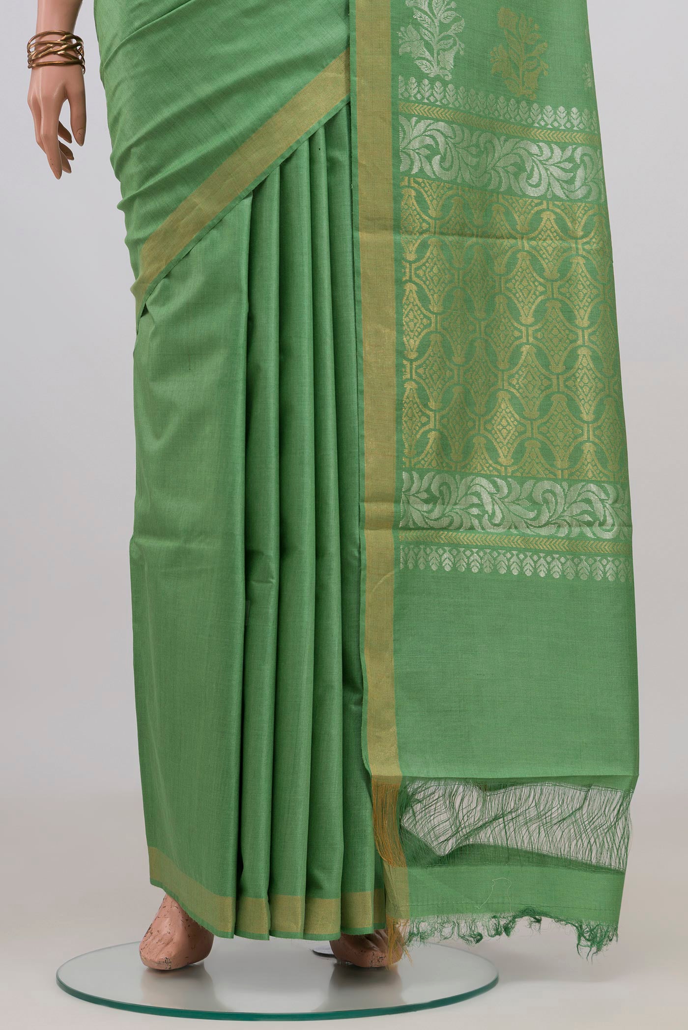 Pleats and pallu of Pista Green Tussar Silk Saree with Plain Body and Zari Border. 