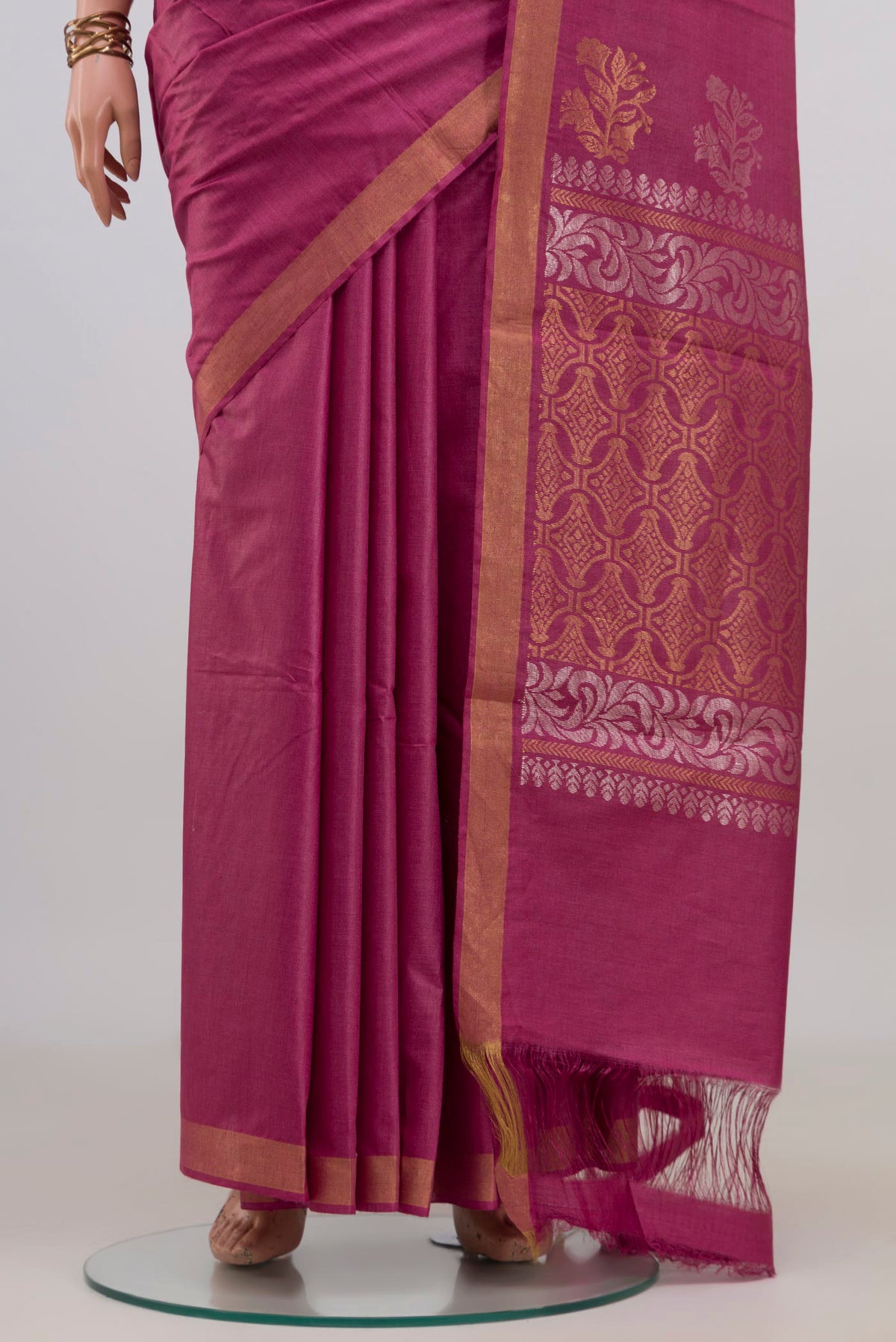 Pleats and pallu of Pink Tussar Saree with Plain Body and Zari Border. 