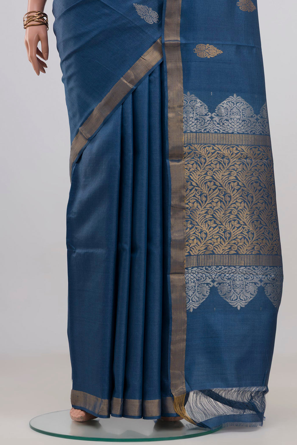 Pleats and pallu of Blue Tussar Silk Saree with Zari Butta on the body and Zari Border. 