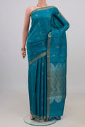 Blue Tussar Silk Saree with Zari Butta on the body and Zari Border.  displayed on a mannequin
