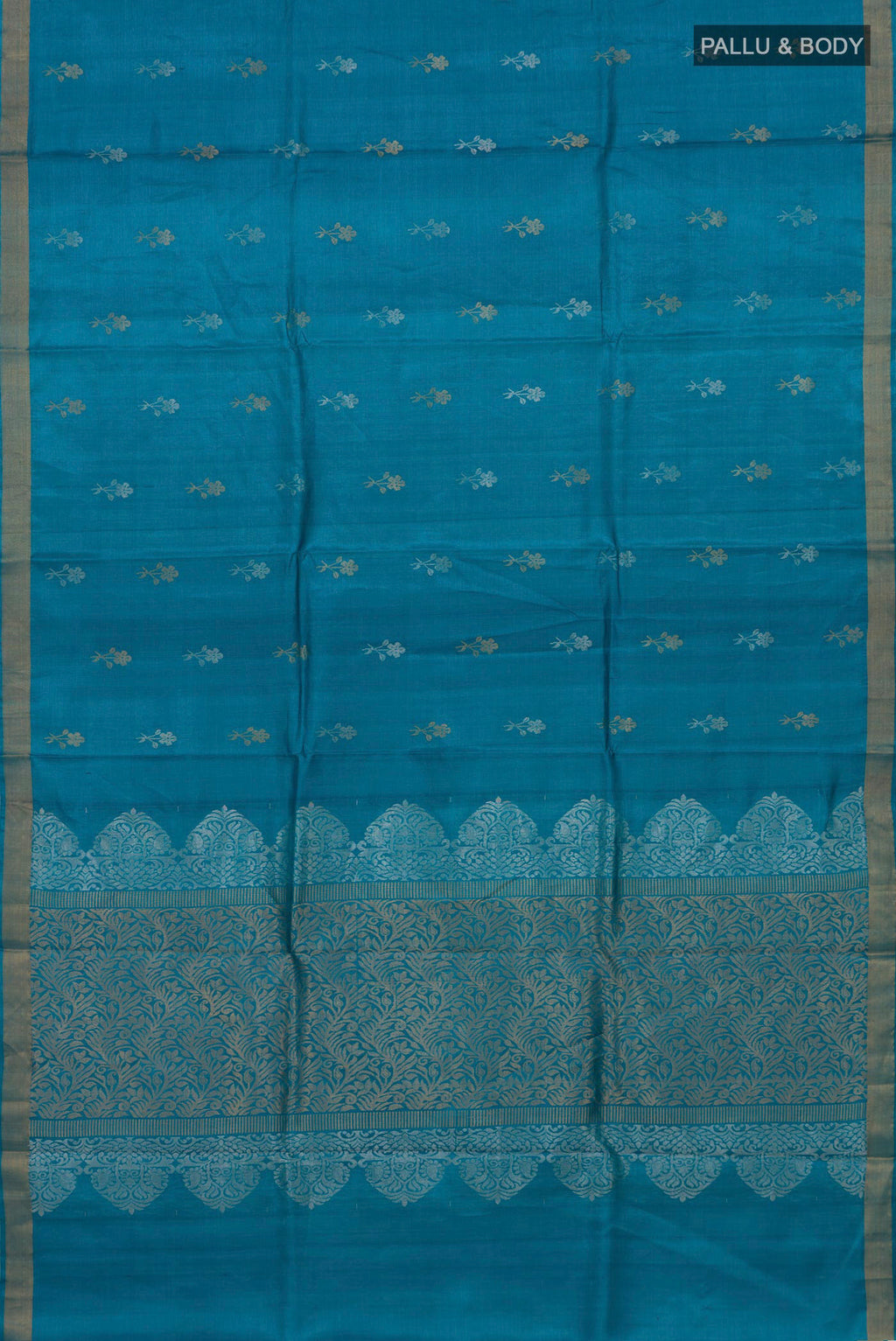 Flat view of Blue Tussar Silk Saree with Zari Butta on the body and Zari Border. 