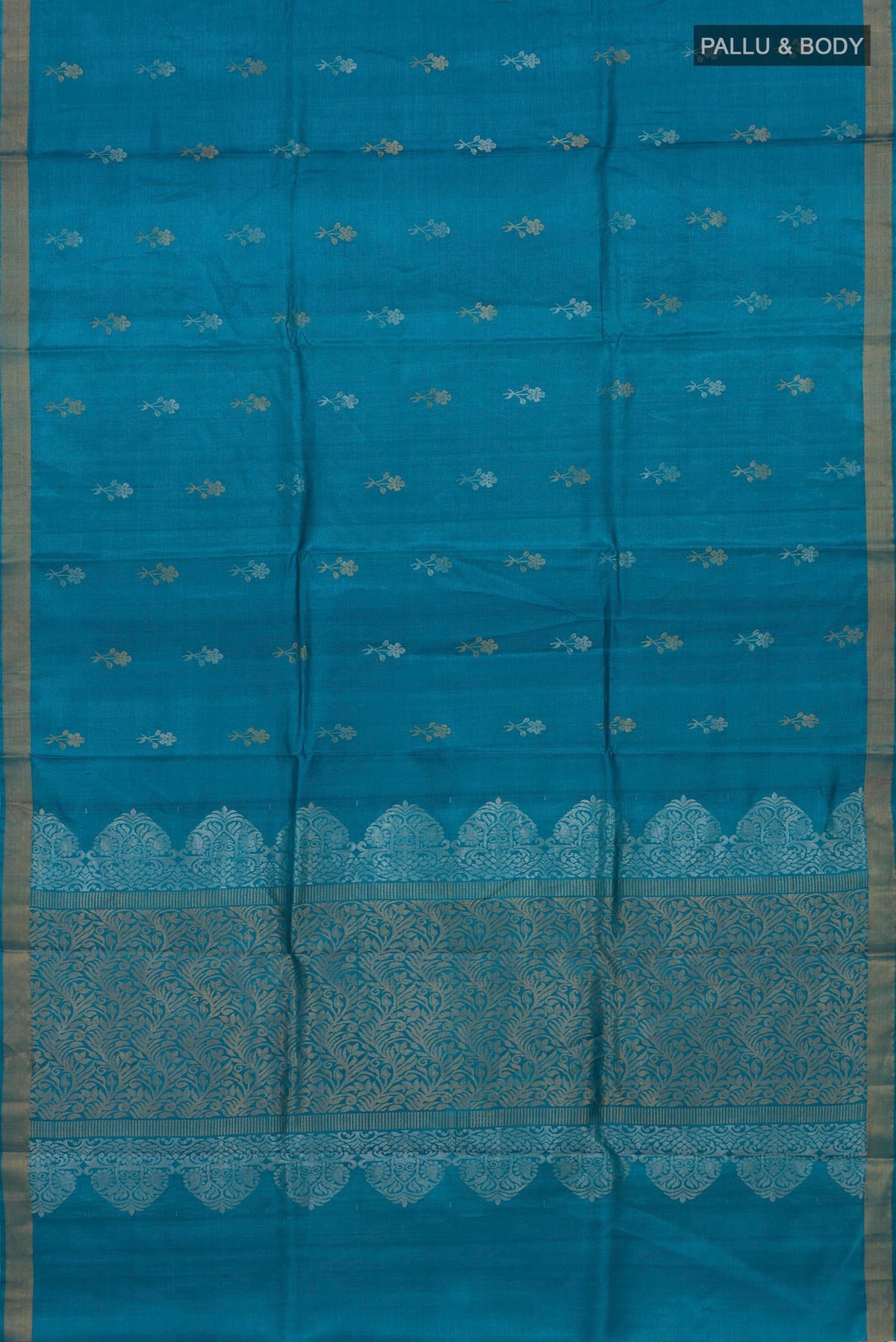 Flat view of Blue Tussar Silk Saree with Zari Butta on the body and Zari Border. 