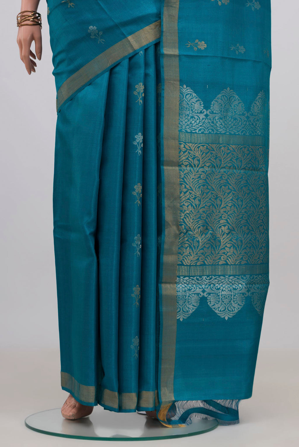 Pleats and pallu of Blue Tussar Silk Saree with Zari Butta on the body and Zari Border. 