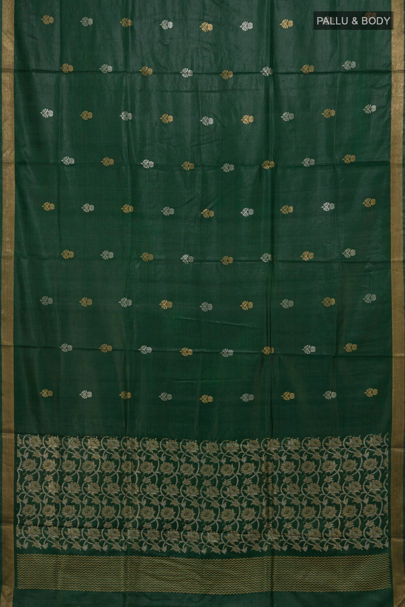 Flat view of Bottle Green Tussar Silk Saree with Zari Butta on the body and Zari Border. 