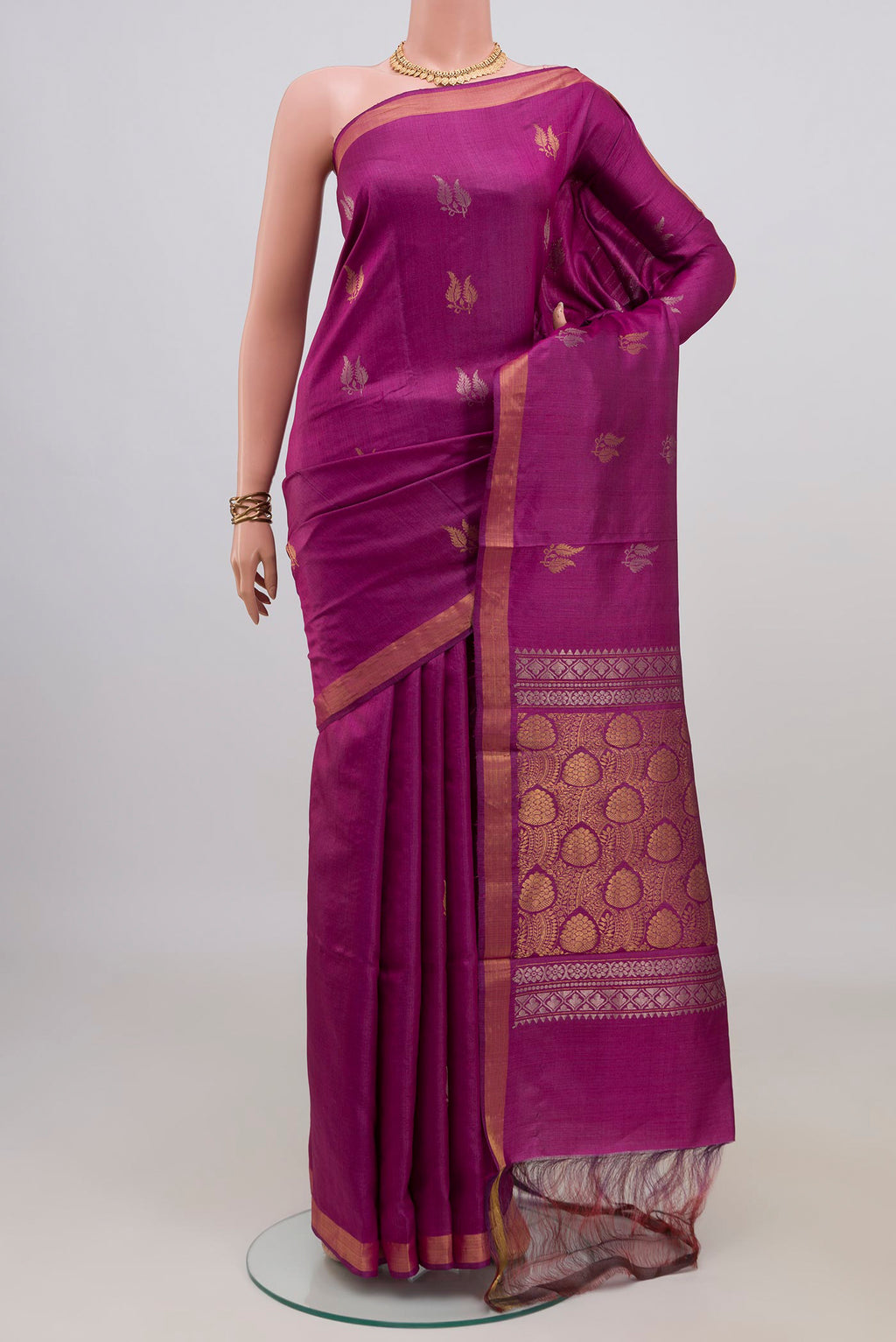 Pure Silk Magenta Tussar Saree with Zari Butta on the body and Zari Border.  displayed on a mannequin