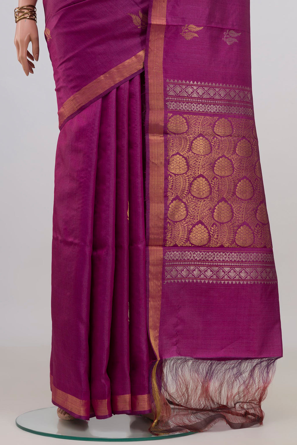 Pleats and pallu of Pure Silk Magenta Tussar Saree with Zari Butta on the body and Zari Border. 