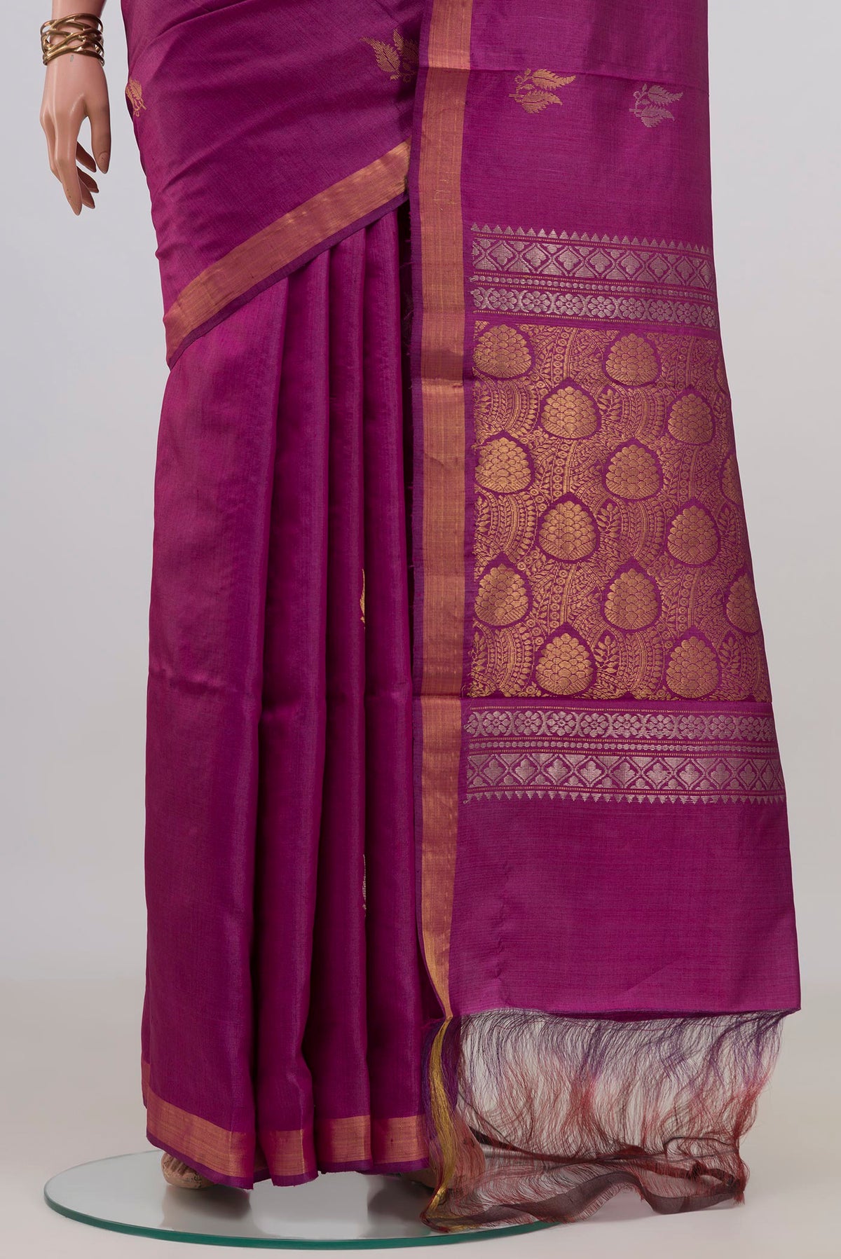 Pleats and pallu of Pure Silk Magenta Tussar Saree with Zari Butta on the body and Zari Border. 