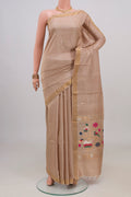 Beige Tussar Silk Saree with Zari Butta on the body and Zari Border.  displayed on a mannequin