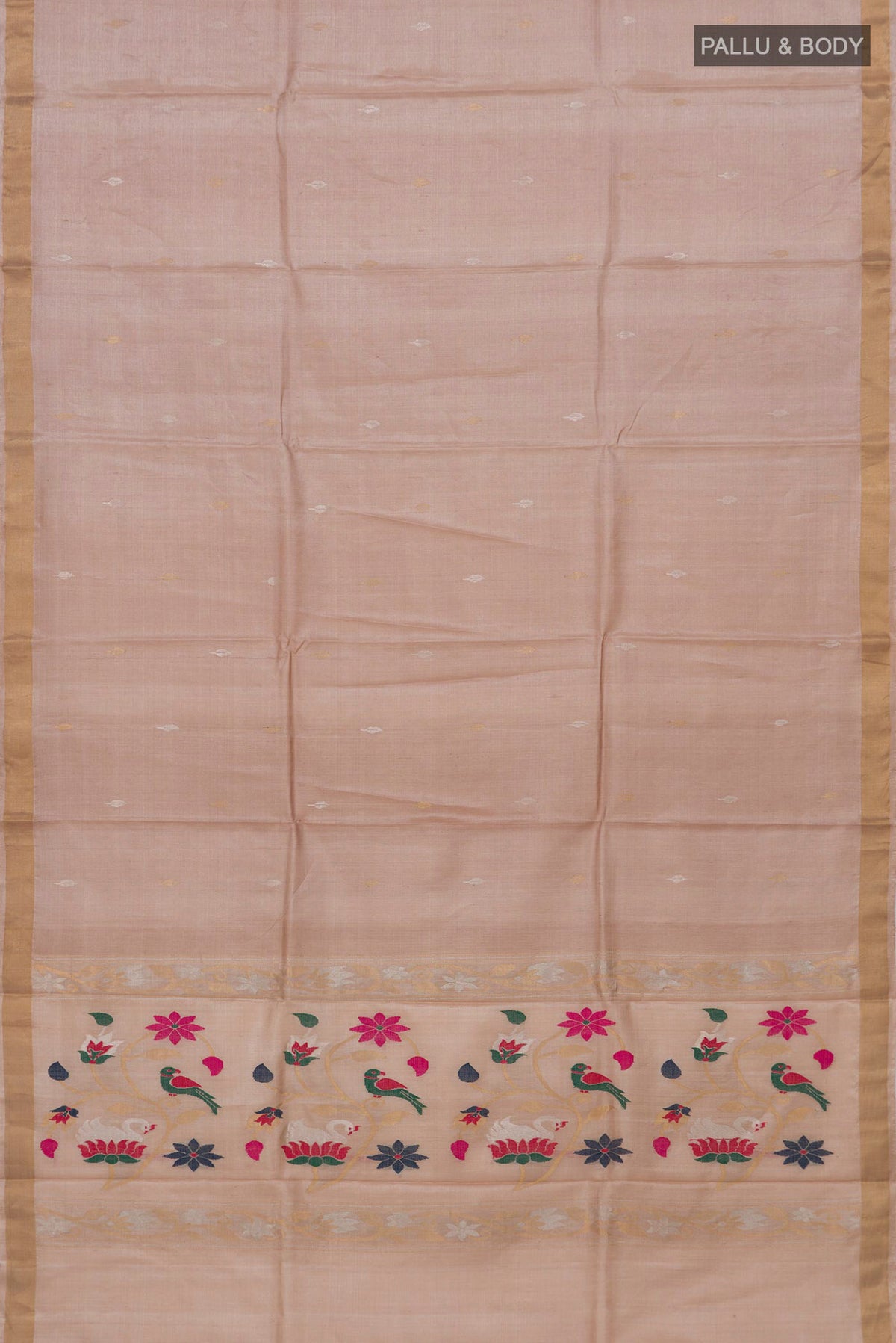 Flat view of Beige Tussar Silk Saree with Zari Butta on the body and Zari Border. 