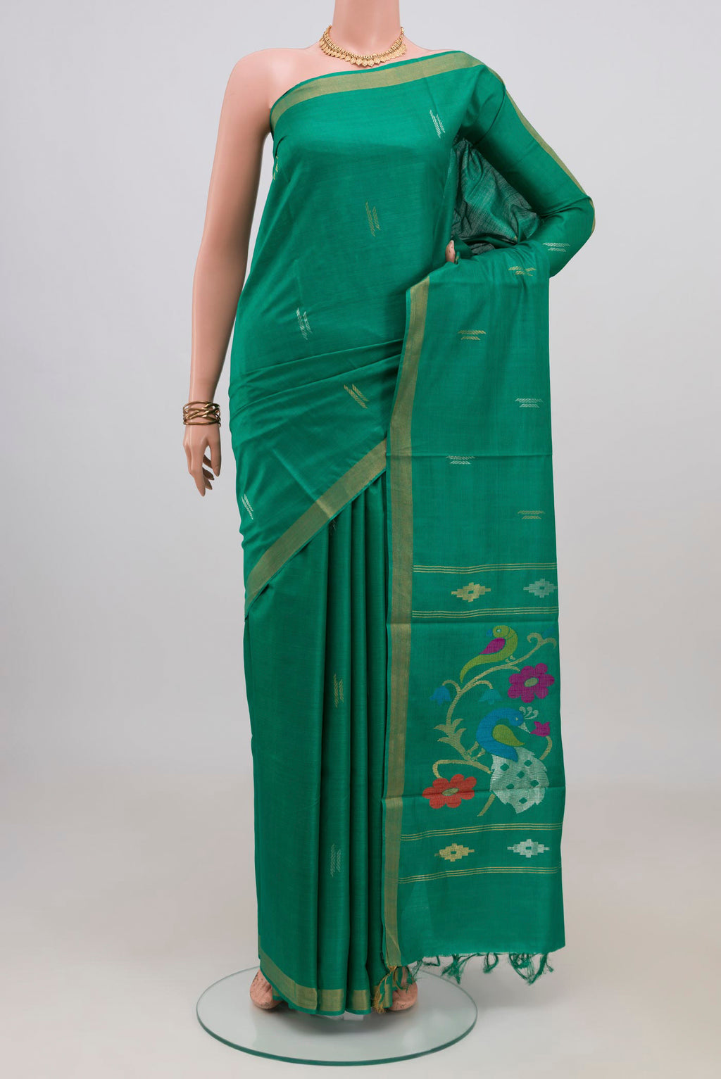 Teal Tussar Silk Saree with Zari Butta on the body and Zari Border.  displayed on a mannequin