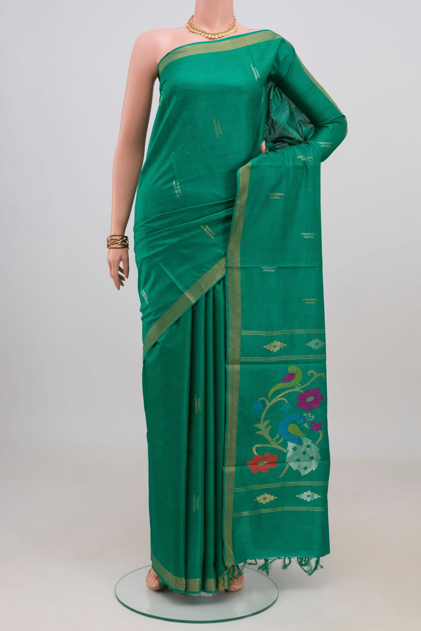 Teal Tussar Silk Saree with Zari Butta on the body and Zari Border.  displayed on a mannequin