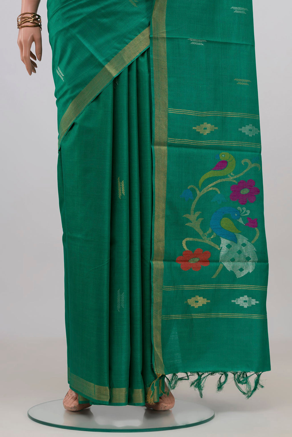 Pleats and pallu of Teal Tussar Silk Saree with Zari Butta on the body and Zari Border. 