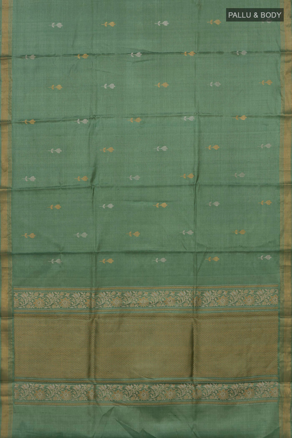 Flat view of Sage Green Tussar Silk Saree with Zari Butta on the body and Zari Border. 