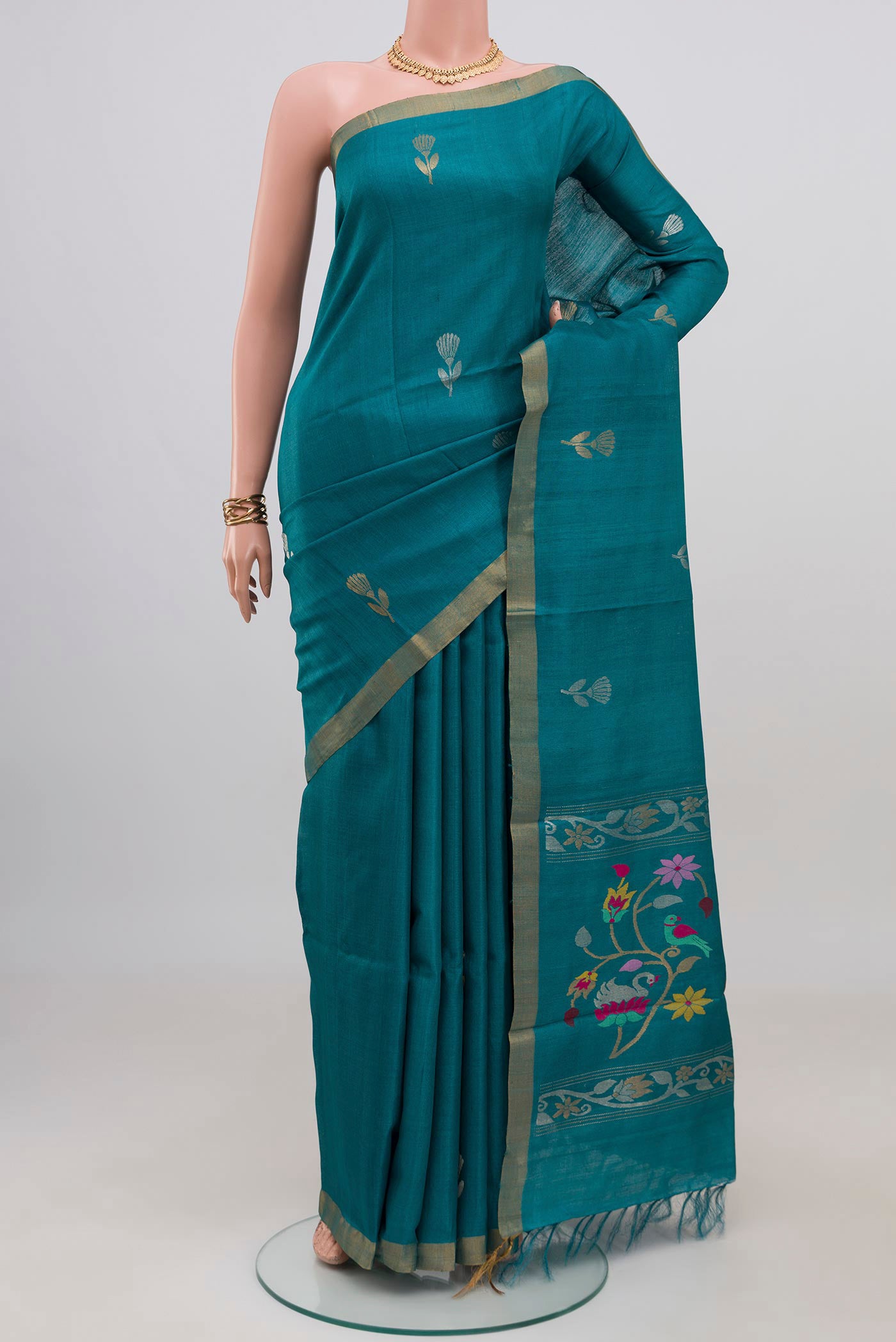 Blue Tussar Silk Saree with Zari Butta on the body and Zari Border.  displayed on a mannequin