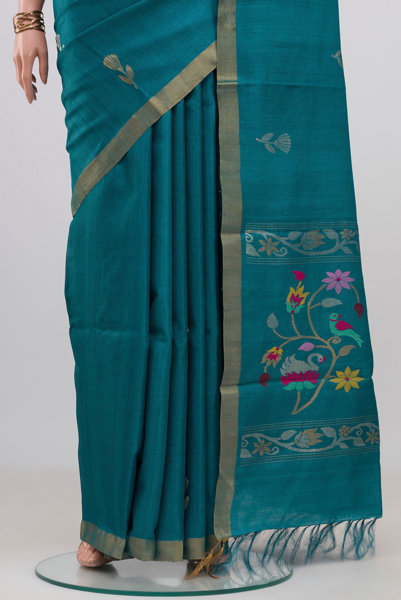 Pleats and pallu of Blue Tussar Silk Saree with Zari Butta on the body and Zari Border. 