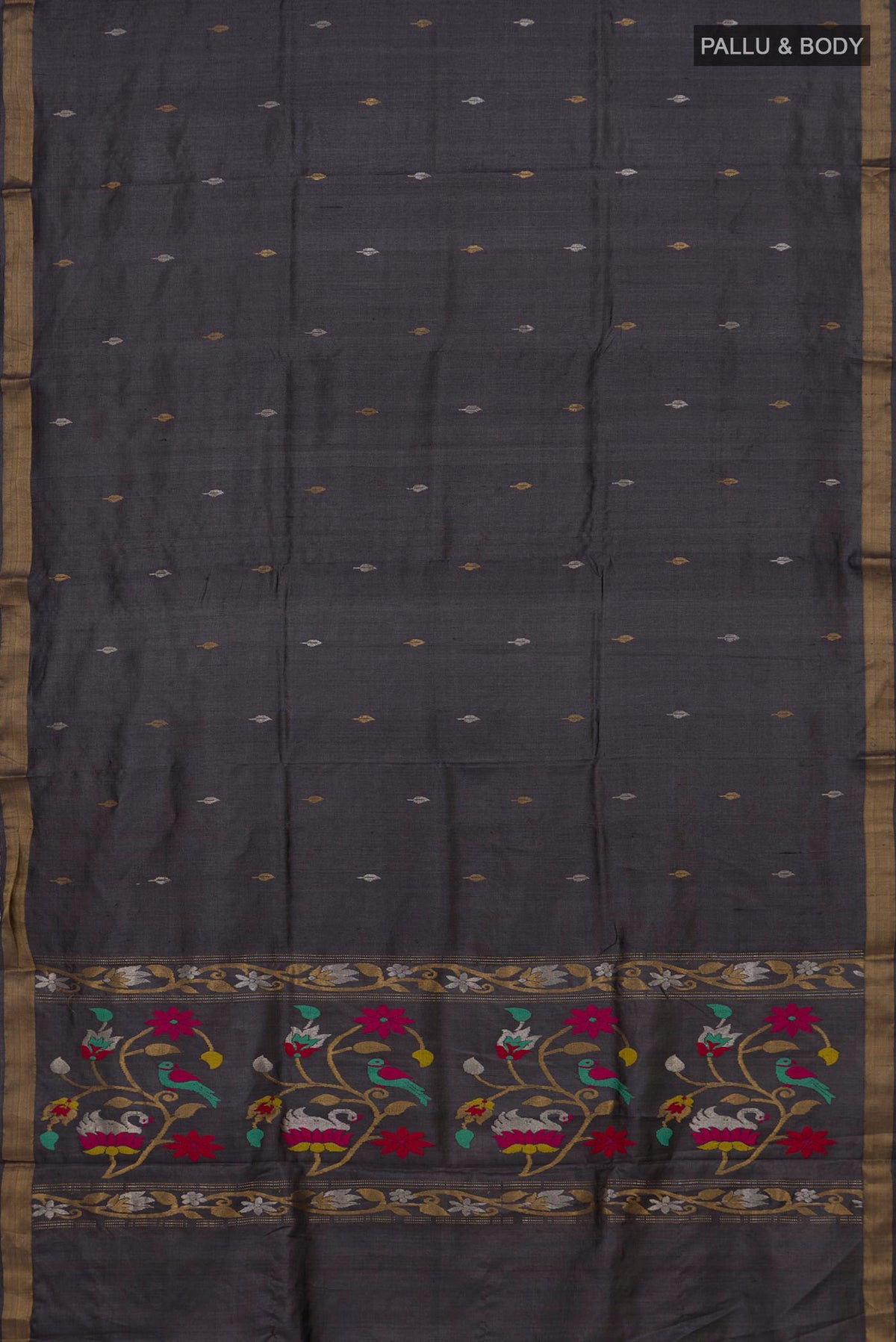 Flat view of Grey Tussar Saree with Zari Butta on the body and Zari Border. 