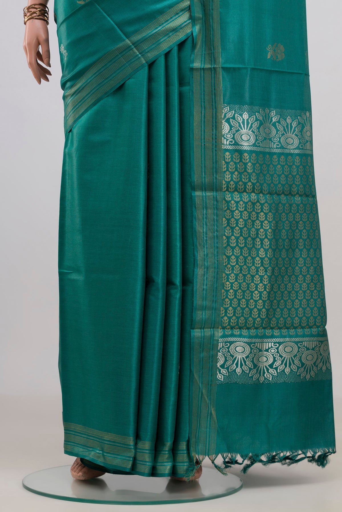 Pleats and pallu of Pure Silk Green Tussar Saree with Zari Butta on the body and Zari Border. 