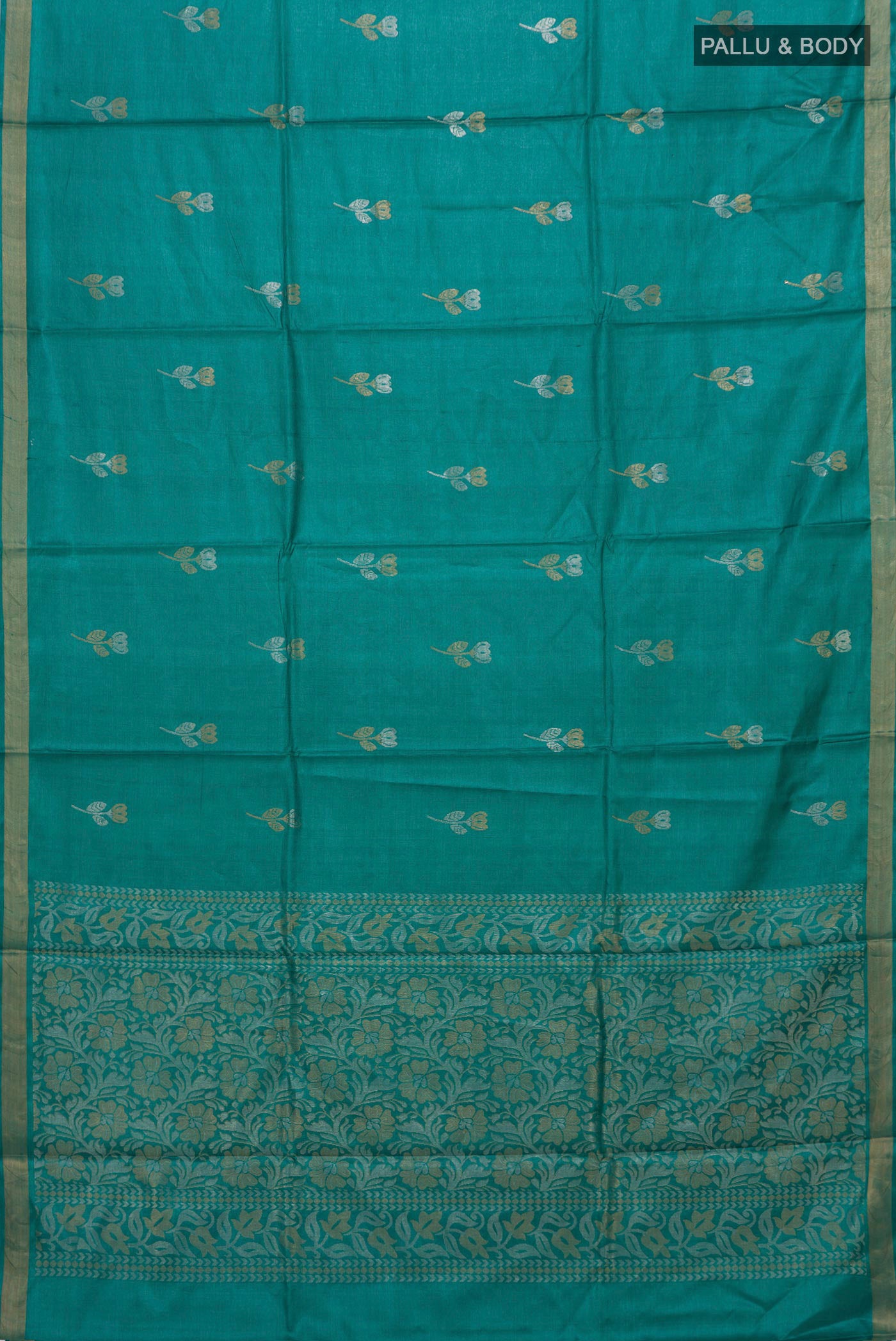 Flat view of Teal Tussar Silk Saree with Zari Butta on the body and Zari Border. 