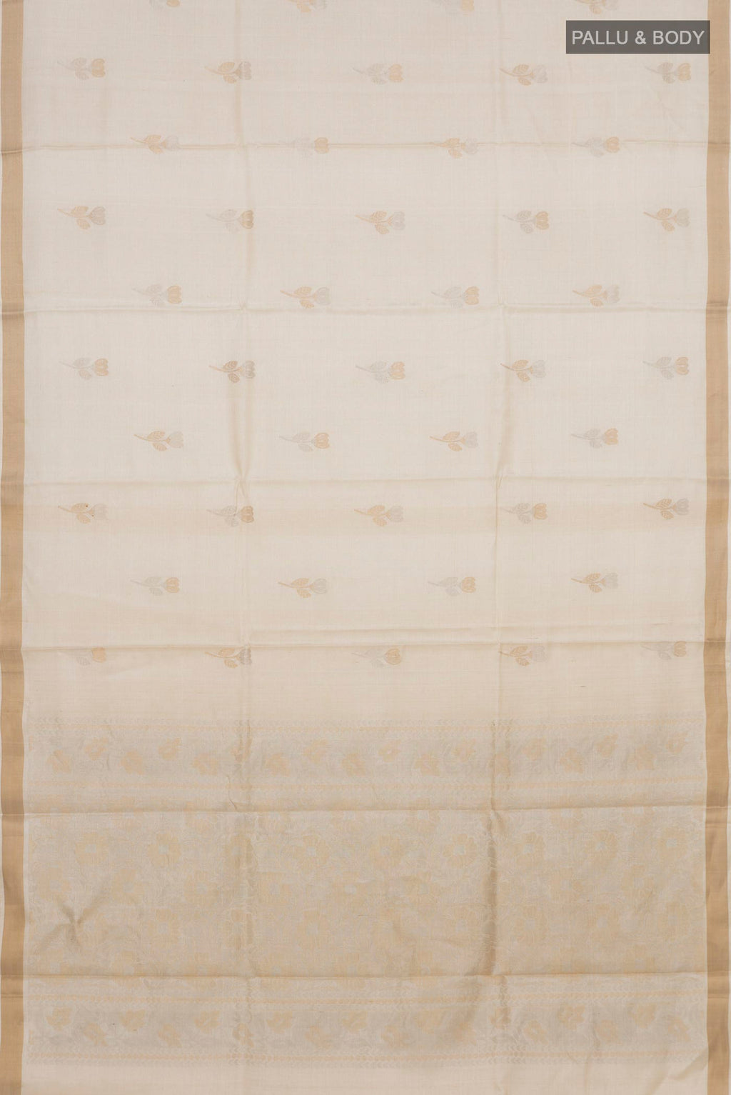 Flat view of Cream Tussar Silk Saree with Zari Butta on the body and Zari Border. 