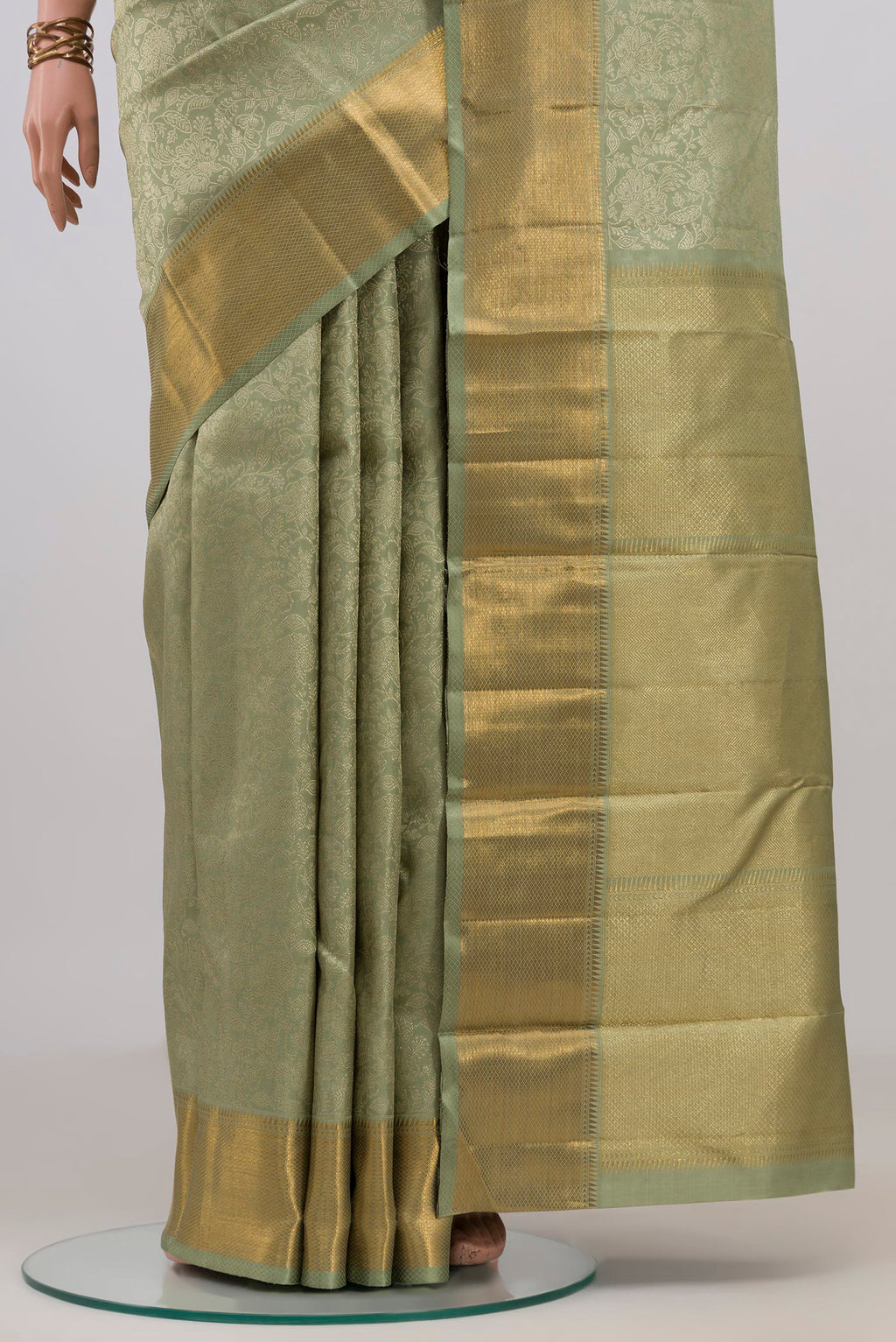 Pleats and pallu of Sage Green Kanchipuram Silk Saree with Zari Brocade on the body and Zari Border. 
