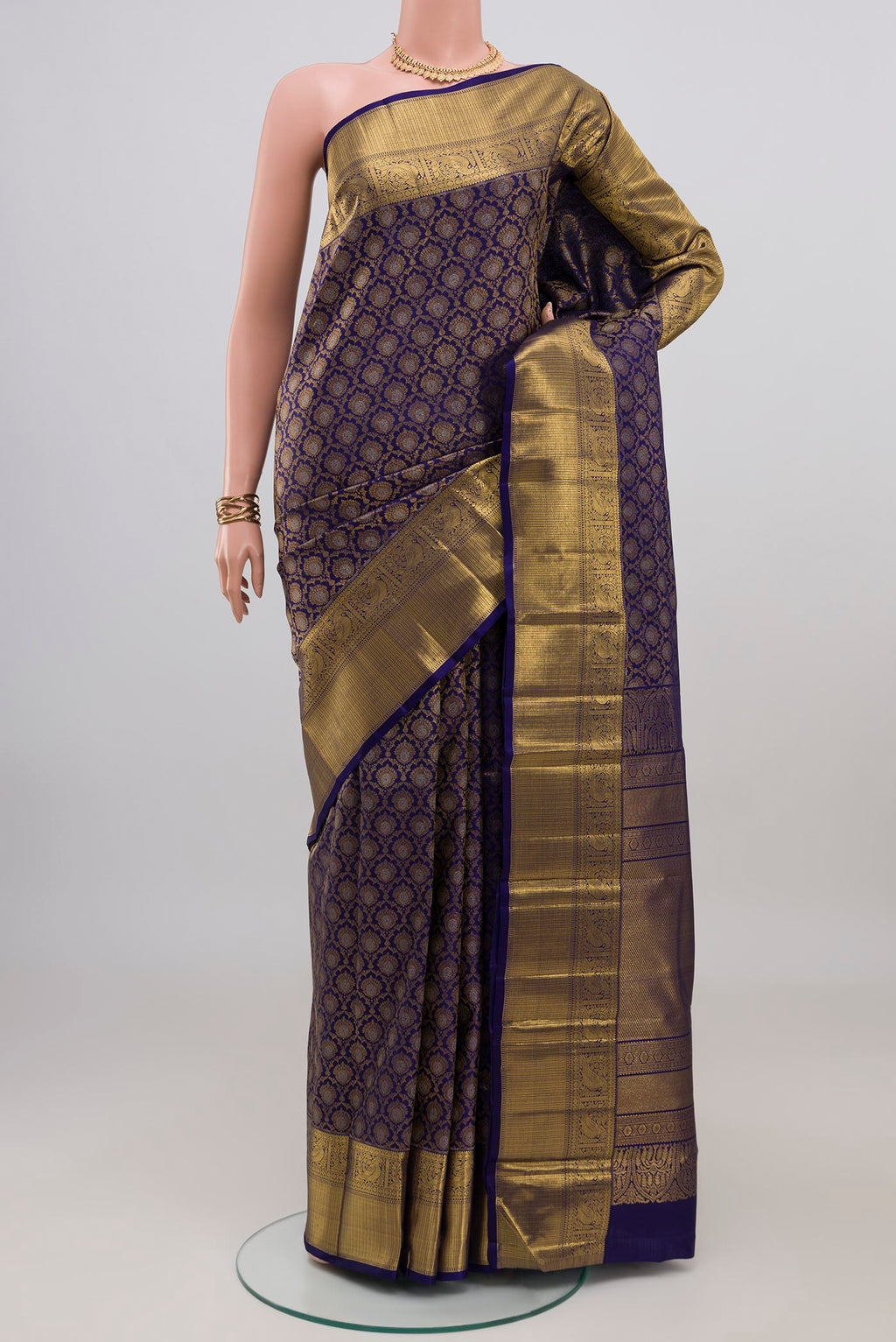 Dark Blue Kanjivaram Silk Saree with Zari Brocade on the body and Zari Border.  displayed on a mannequin
