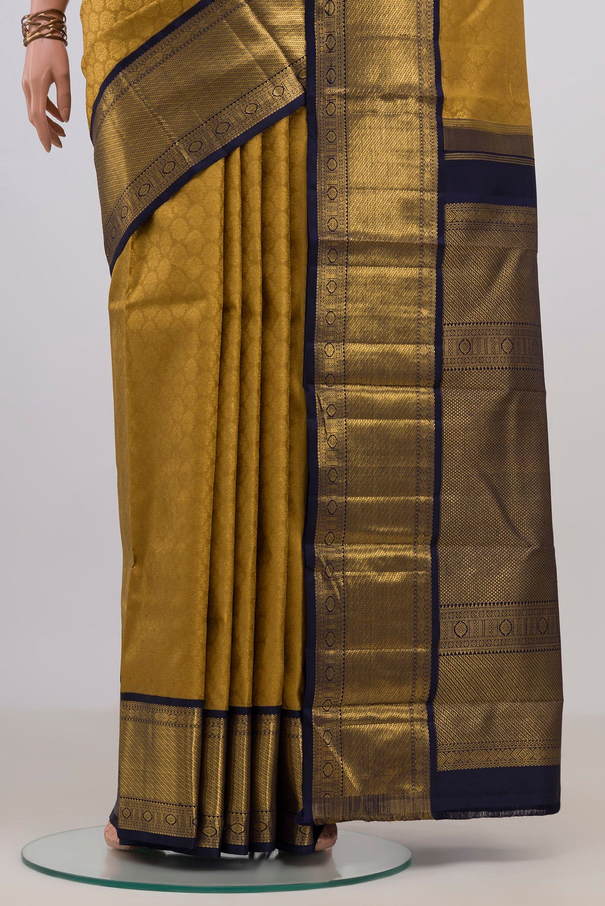 Pleats and pallu of Pure Silk Golden Kanjivaram Saree with Zari Brocade on the body and Zari Border. 