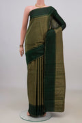 Pure Silk Bottle Green Kanchipuram Saree with Checked design on the body and Thin Zari Line.  displayed on a mannequin