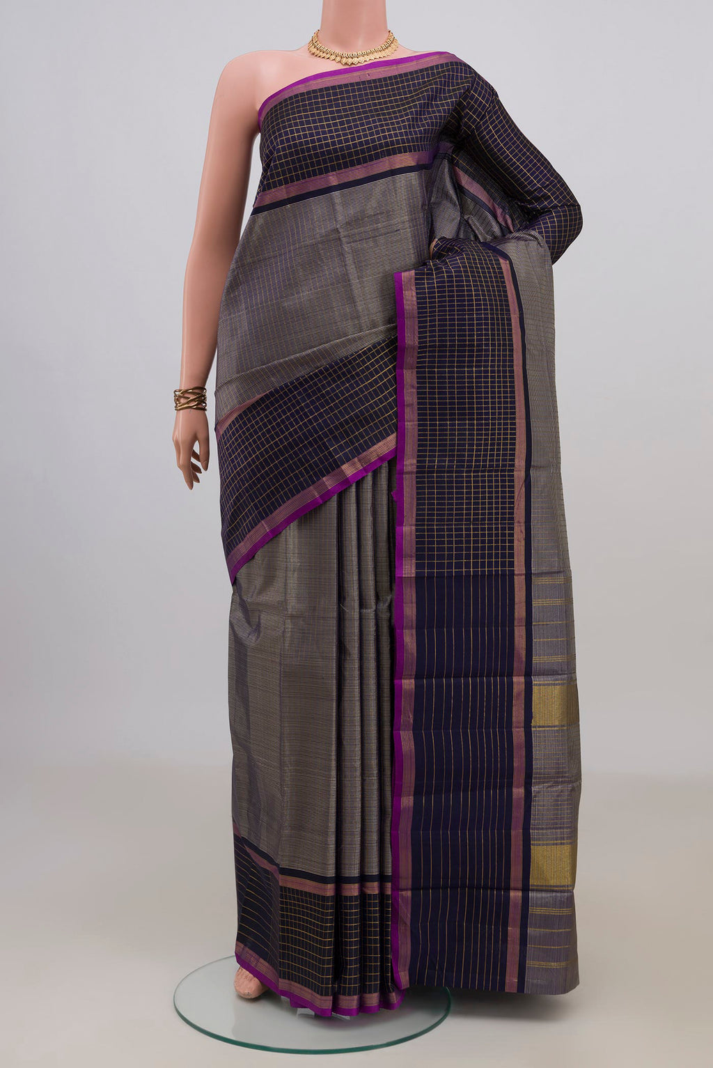 Pure Silk Navy Blue Kanchipuram Saree with Checked design on the body and Checks Border.  displayed on a mannequin