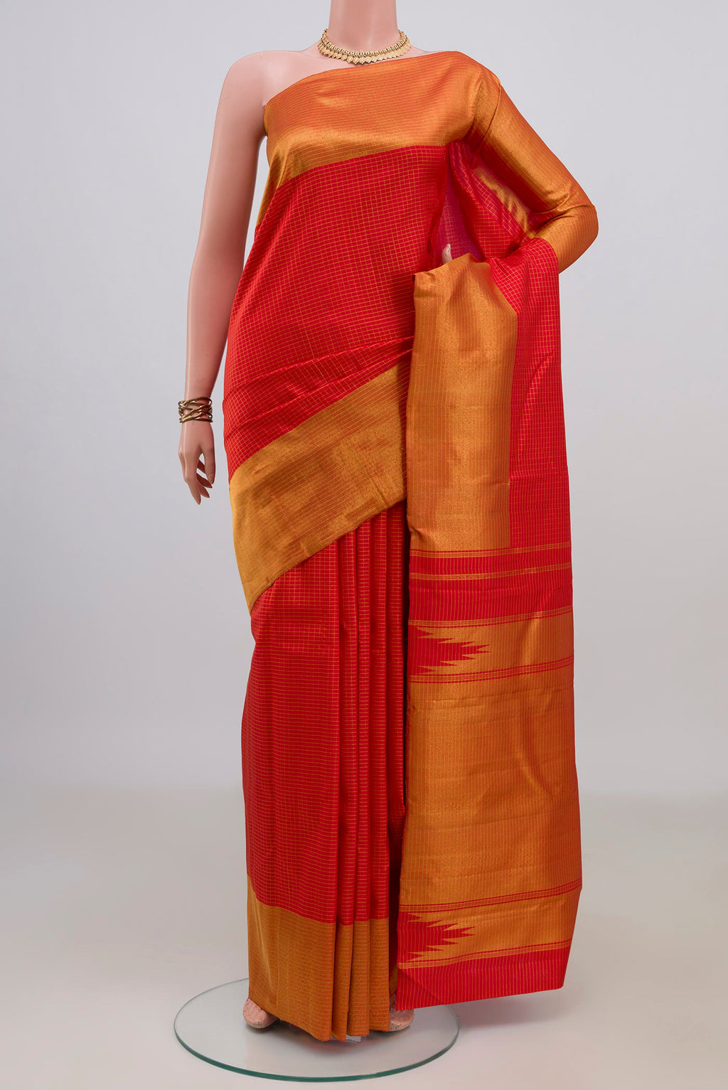 Pure Silk Red Kanjivaram Saree with Checked design on the body and Zari Border.  displayed on a mannequin