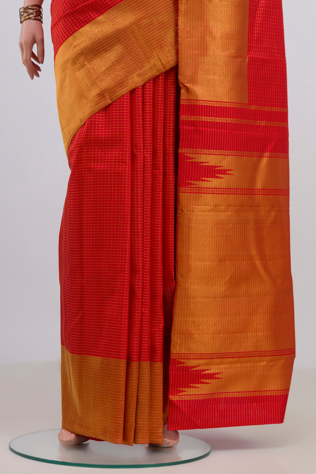 Pleats and pallu of Pure Silk Red Kanjivaram Saree with Checked design on the body and Zari Border. 