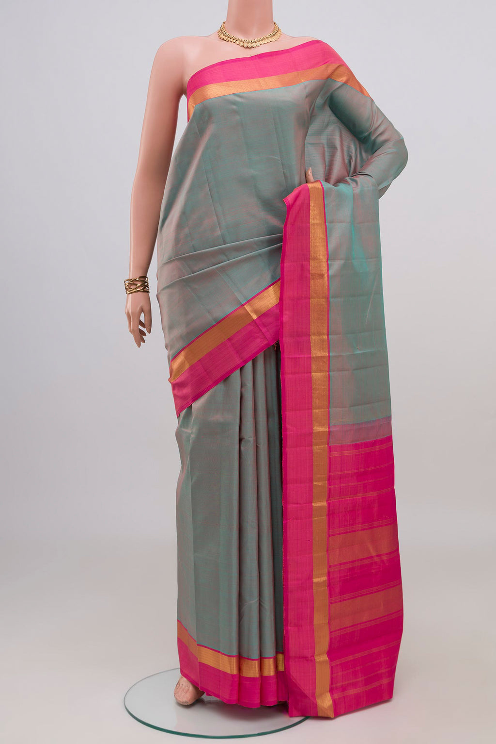 Grey with Pink Color Kanjivaram Silk Saree with Plain Body and Zari Border.  displayed on a mannequin