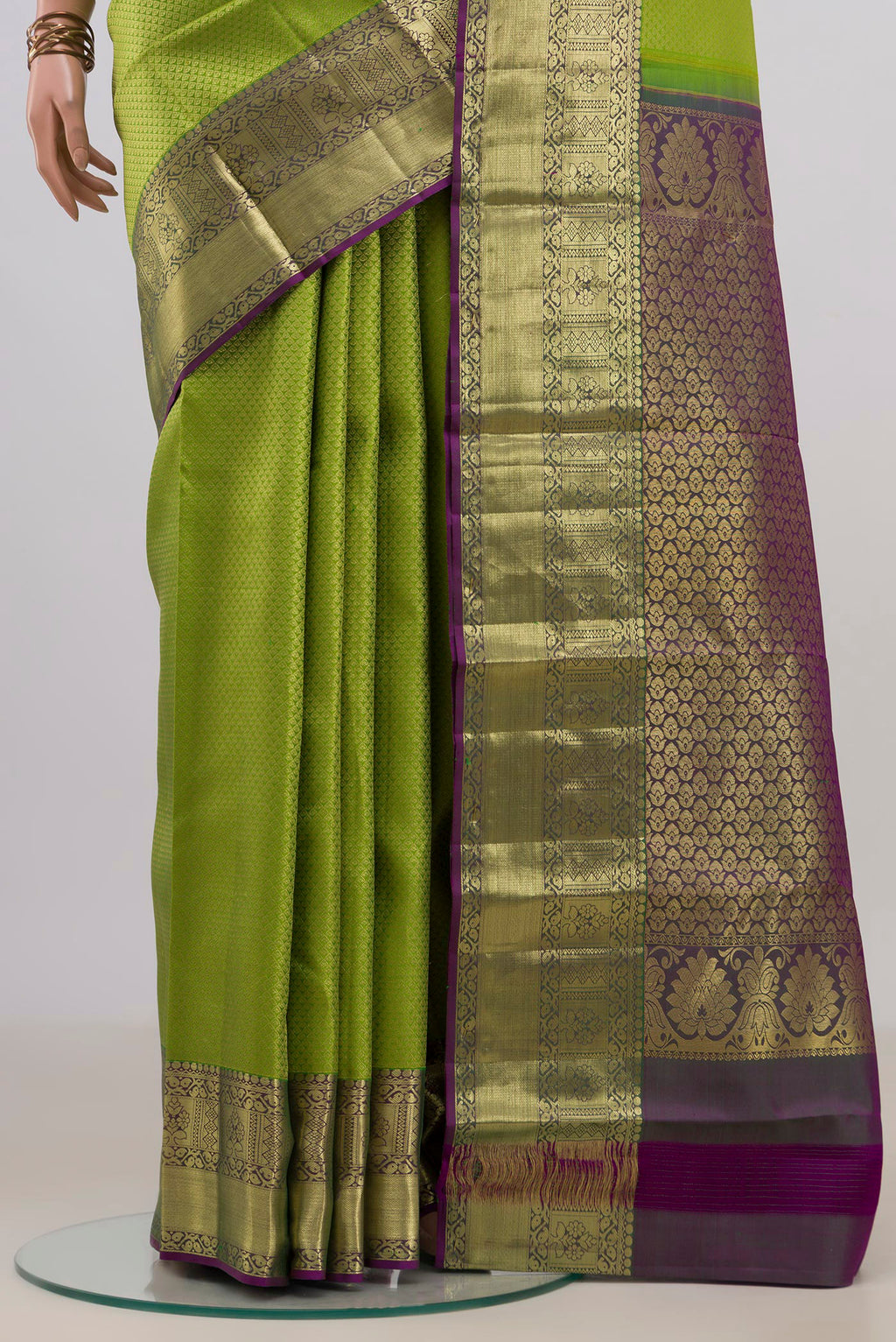 Pleats and pallu of Pure Silk Parrot Green Kanchipuram Saree with Zari Brocade on the body and Zari Border. 