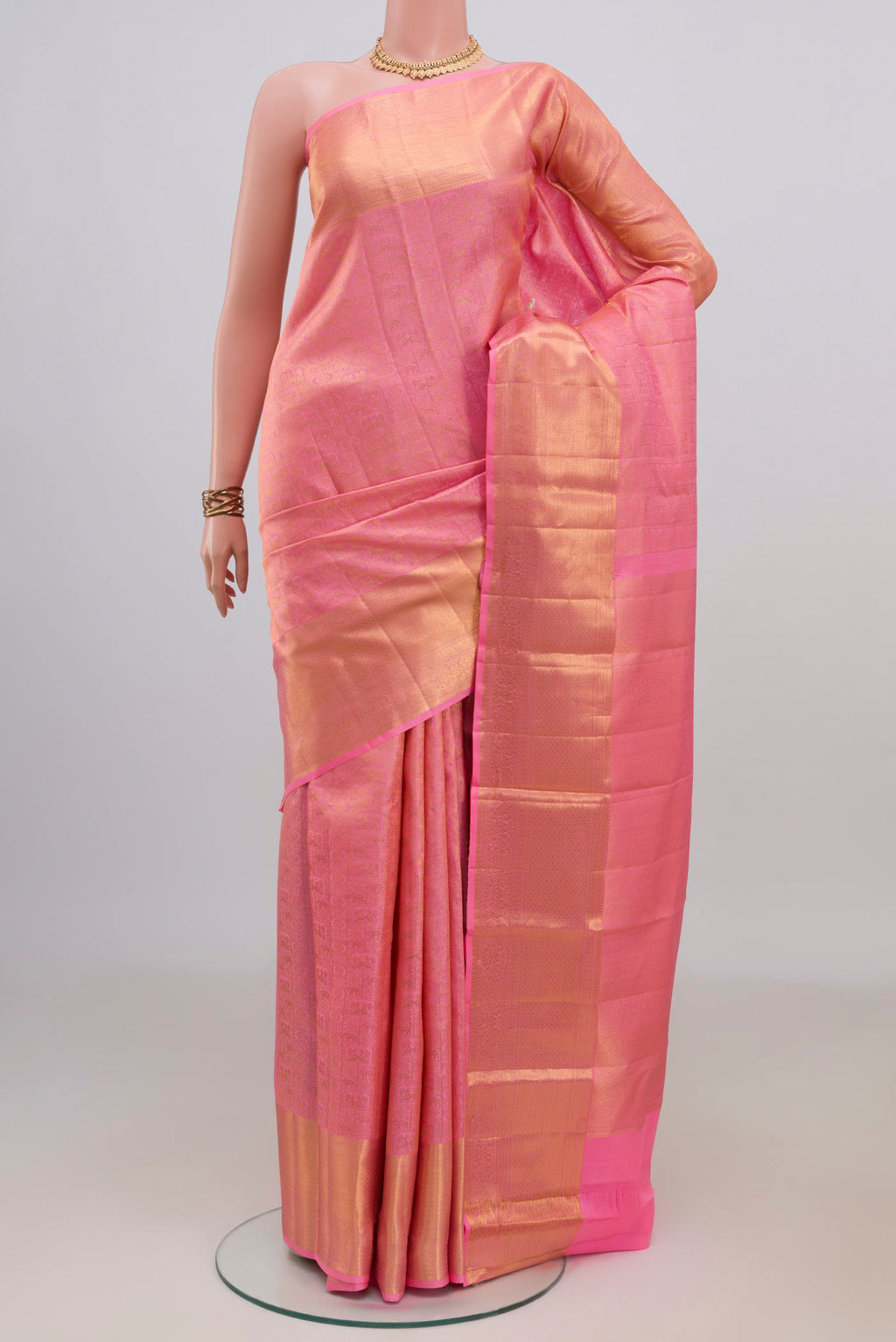Pure Silk Pink Kanchipuram Saree with Zari Brocade on the body and Zari Border.  displayed on a mannequin