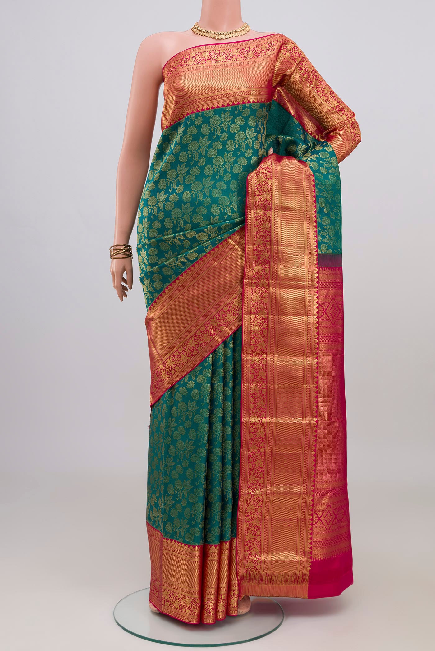 Sea Green Kanchipuram Silk Saree with Zari Brocade on the body and Zari Border.  displayed on a mannequin