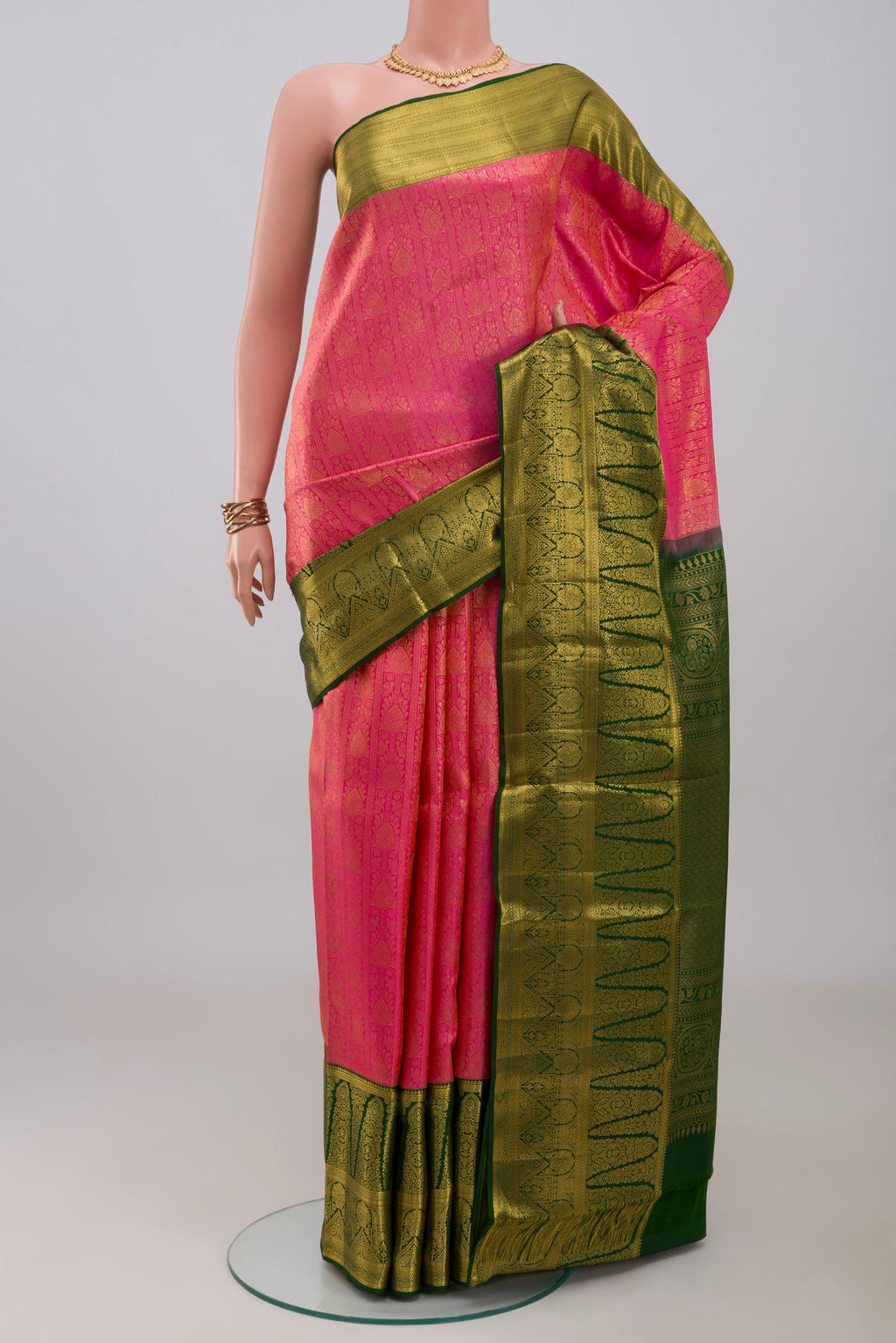Pink Kanchipuram Silk Saree with Zari Brocade on the body and Zari Border.  displayed on a mannequin