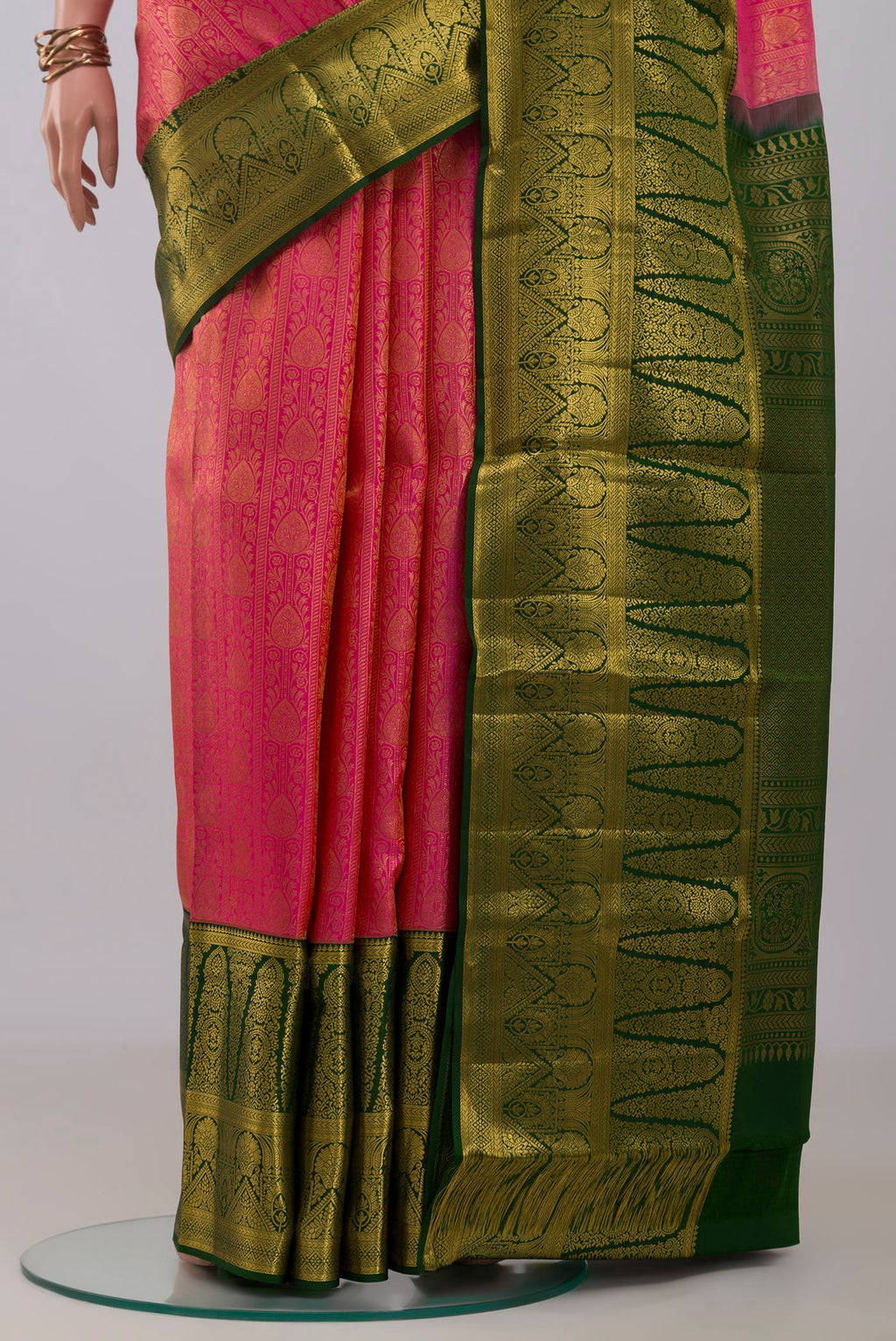 Pleats and pallu of Pink Kanchipuram Silk Saree with Zari Brocade on the body and Zari Border. 