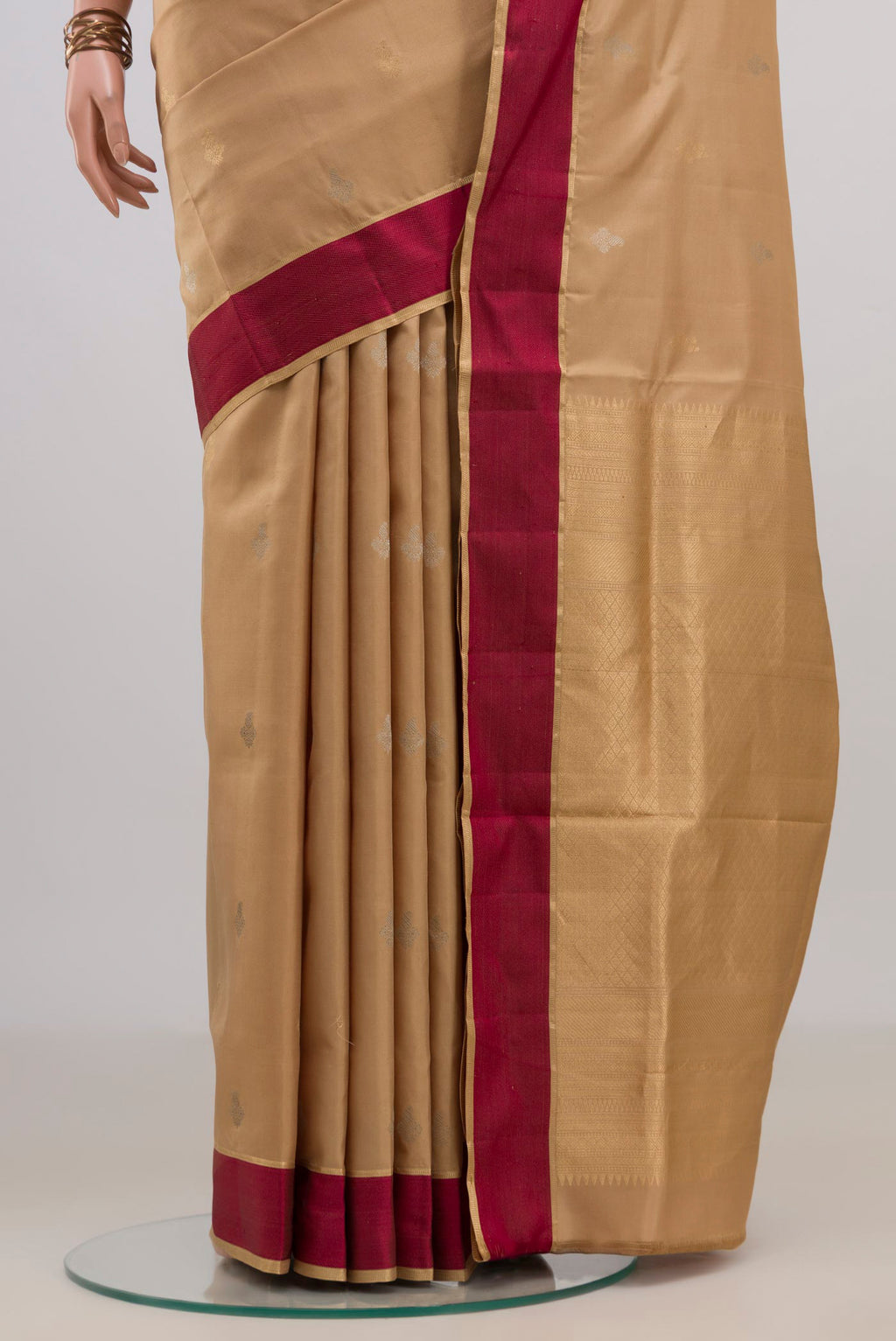 Pleats and pallu of Pure Silk Sandal Soft Saree with Zari Butta on the body and Thin Zari Line. 