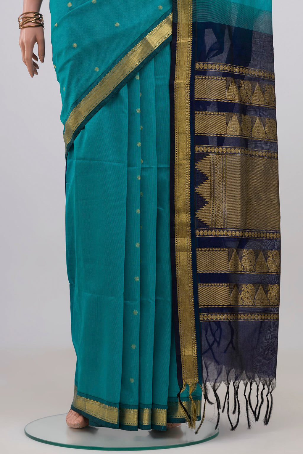 Pleats and pallu of Light Blue Silk Cotton Saree with Zari Butta on the body and Zari Border. 