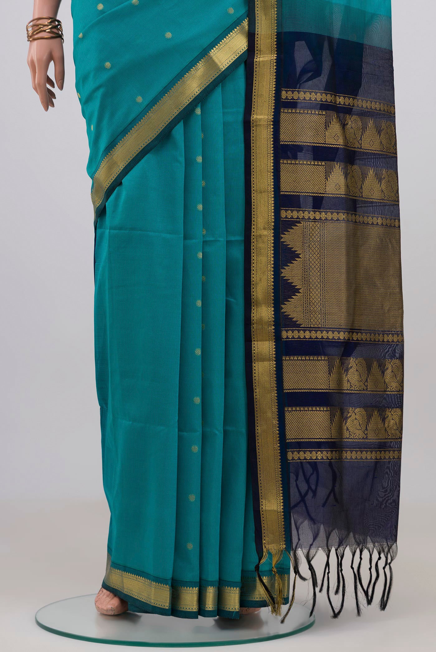 Pleats and pallu of Light Blue Silk Cotton Saree with Zari Butta on the body and Zari Border. 