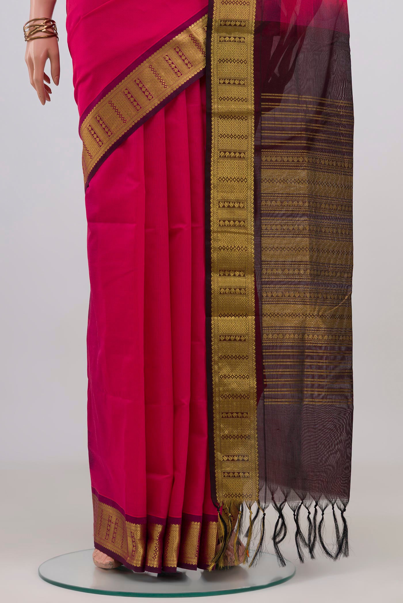 Pleats and pallu of Pink Silk Cotton Saree with Plain Body and Zari Border. 