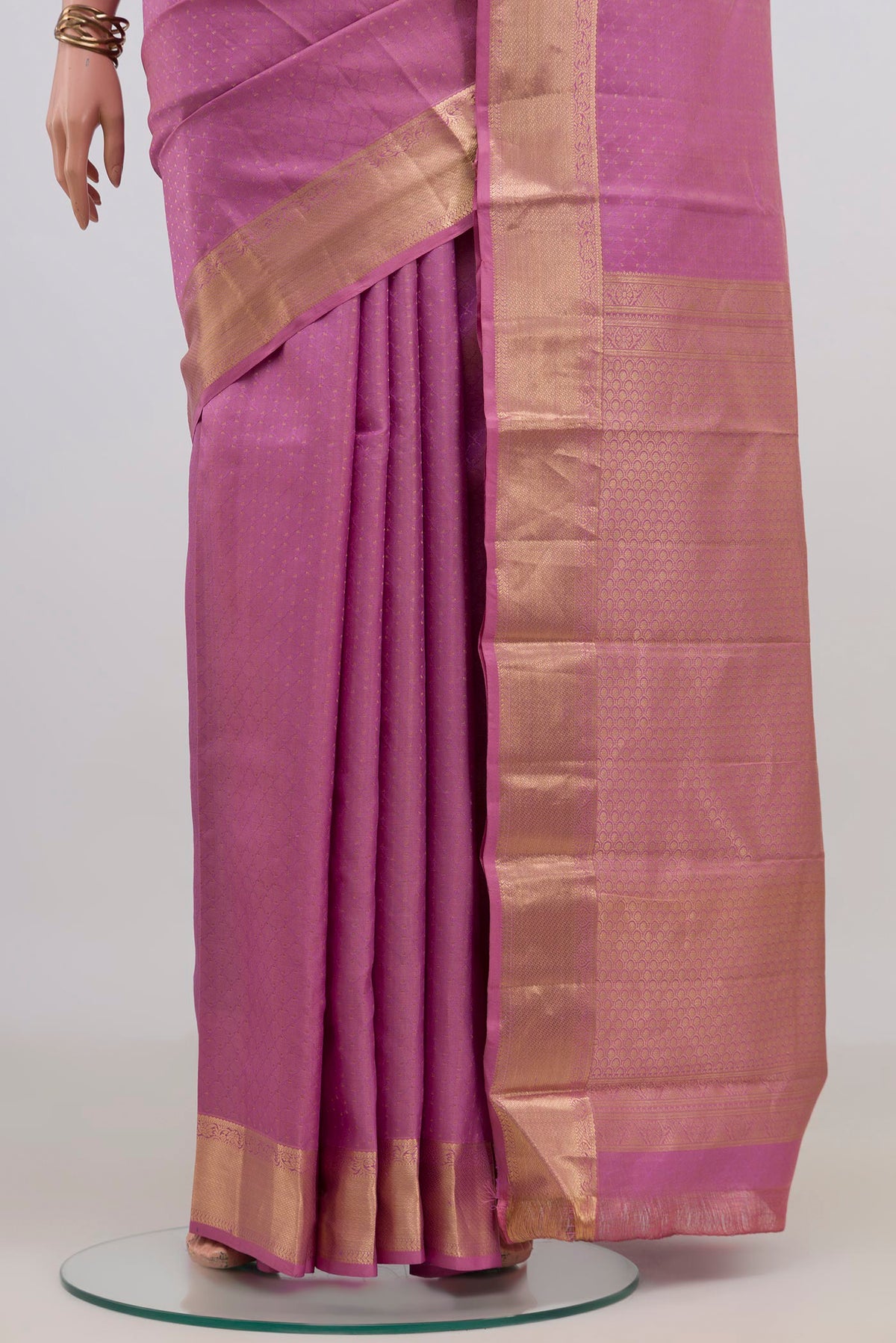 Pleats and pallu of Pure Silk Pink Kanjivaram Saree with Jacquard design on the body and Zari Border. 
