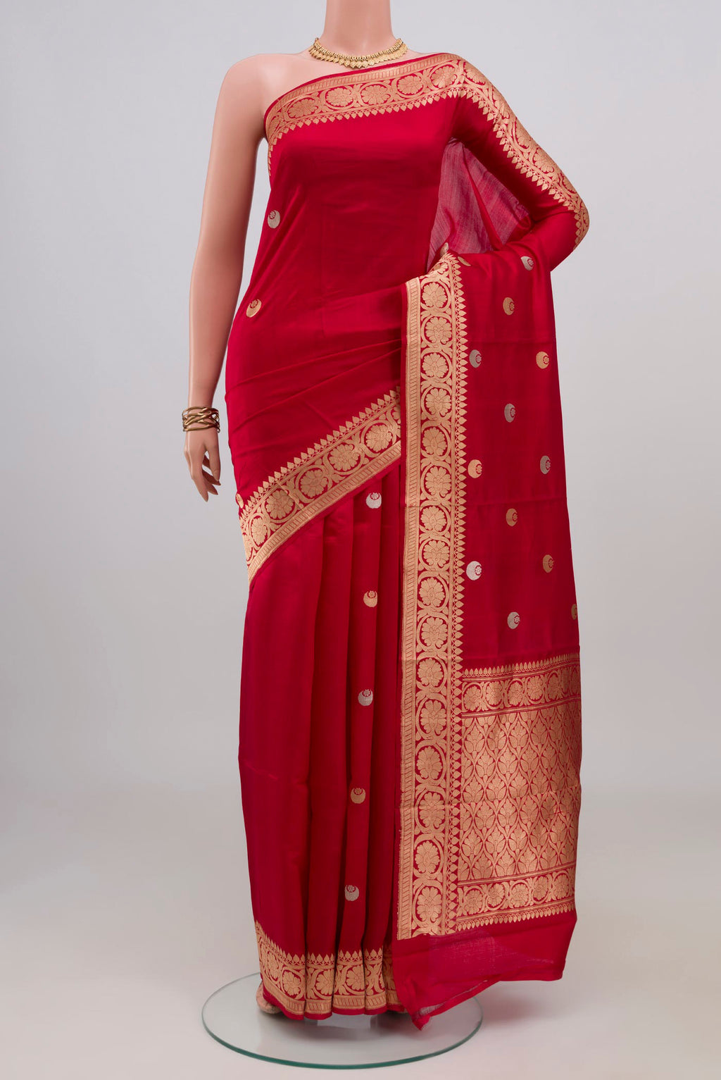 Red Banarasi Katan Silk Saree with Zari Butta on the body and Fancy Border.  displayed on a mannequin